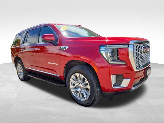 2024 GMC Yukon Denali in Volcanic Red Tintcoat — front three-quarter view