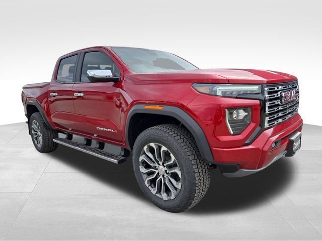 2026 GMC Canyon Denali in Volcanic Red Tintcoat — front three-quarter view