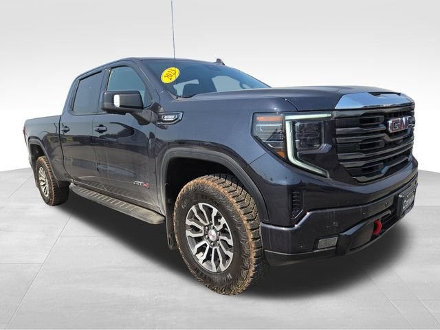 2023 GMC Sierra 1500 AT4 in Titanium Rush Metallic — front three-quarter view